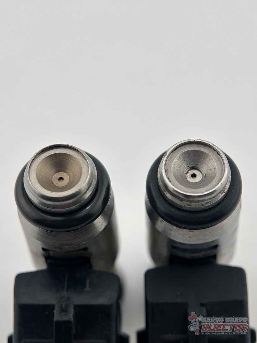 Two IWP069 injector nozzle tips side by side, genuine versus counterfeit