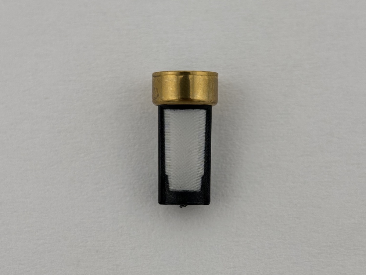 Yamaha OEM red mesh filter next to standard white mesh filter — same body, direct replacement